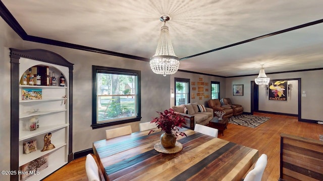724 York St, Rocky Mount, NC 27803 - dining space featuring a notable chandelier, plenty of natural light, and wood finished floors
