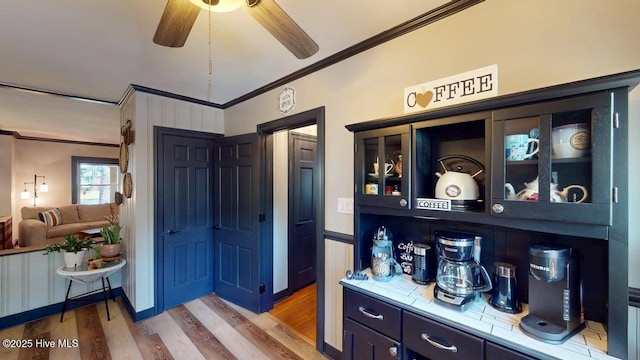 724 York St, Rocky Mount, NC 27803 - bar featuring crown molding, a ceiling fan, and wood finished floors
