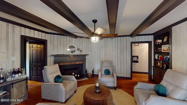 724 York St, Rocky Mount, NC 27803 - living room featuring ceiling fan, beam ceiling, a fireplace, wood finished floors, and ornamental molding