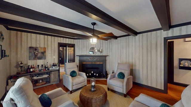 724 York St, Rocky Mount, NC 27803 - living room featuring a fireplace with flush hearth, wood finished floors, beam ceiling, and wallpapered walls