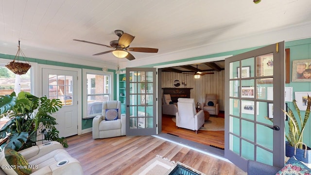 724 York St, Rocky Mount, NC 27803 - interior space with ceiling fan, wood walls, wood finished floors, and a wealth of natural light