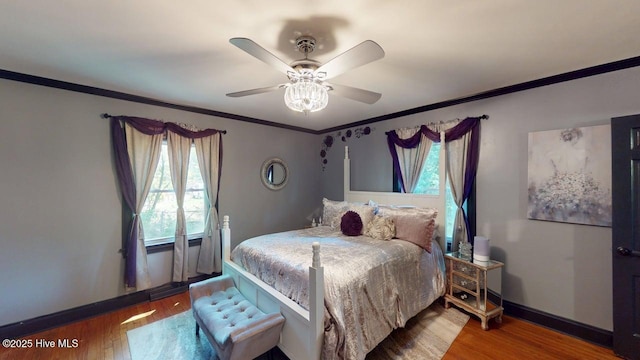 724 York St, Rocky Mount, NC 27803 - bedroom featuring crown molding, a ceiling fan, baseboards, and wood finished floors