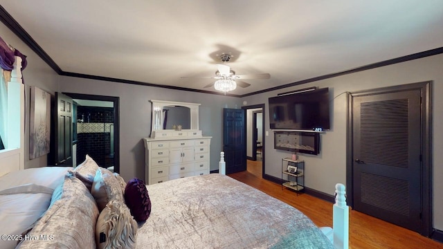 724 York St, Rocky Mount, NC 27803 - bedroom with crown molding, a ceiling fan, baseboards, and wood finished floors