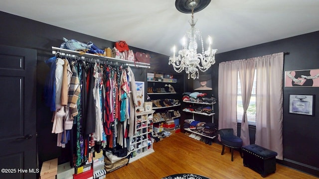 724 York St, Rocky Mount, NC 27803 - walk in closet with a notable chandelier and wood finished floors
