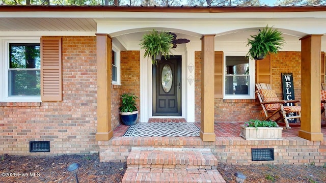 724 York St, Rocky Mount, NC 27803 - doorway to property with a porch, crawl space, and brick siding