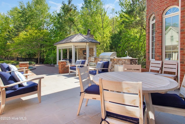 view of patio featuring a gazebo, outdoor lounge area, outdoor dining area, a grill, and area for grilling