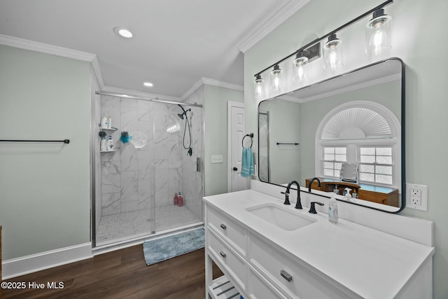 full bath with crown molding, recessed lighting, a marble finish shower, and wood finished floors