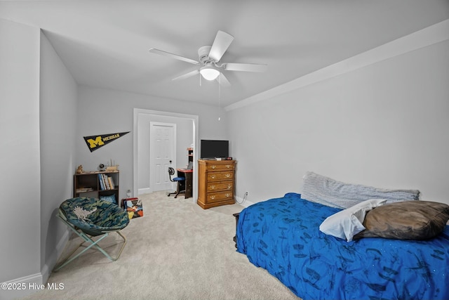 carpeted bedroom with baseboards and ceiling fan