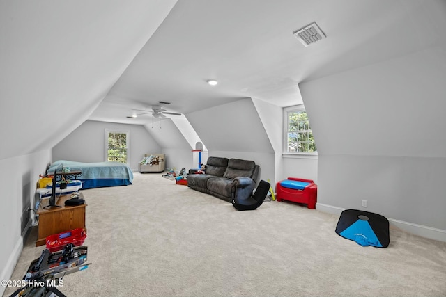 playroom featuring carpet, visible vents, baseboards, and lofted ceiling