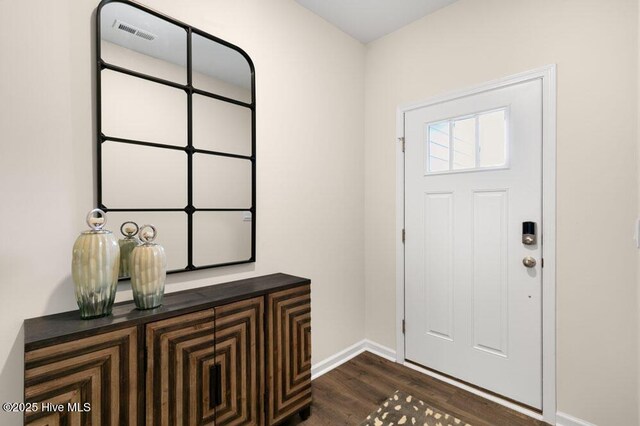 3048 Platinum Cir W, End, NC 27376 - foyer entrance featuring dark wood-style flooring and baseboards