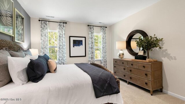 3048 Platinum Cir W, End, NC 27376 - bedroom featuring light carpet, visible vents, and baseboards