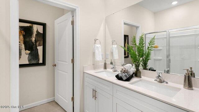 3048 Platinum Cir W, End, NC 27376 - full bath featuring a shower stall, tile patterned floors, double vanity, and a sink