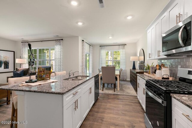 3048 Platinum Cir W, End, NC 27376 - kitchen featuring a sink, appliances with stainless steel finishes, recessed lighting, and a healthy amount of sunlight