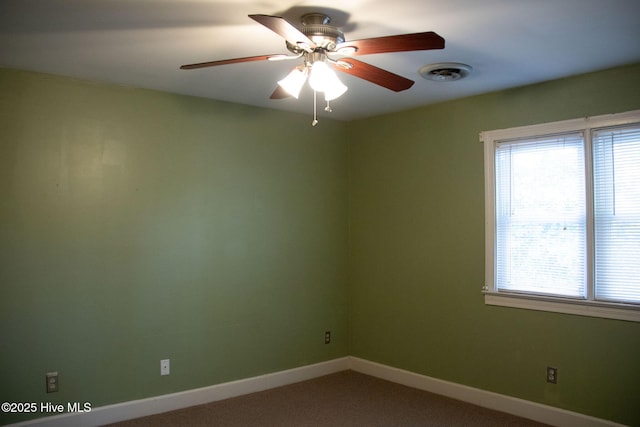 empty room featuring visible vents, baseboards, a ceiling fan, and carpet flooring