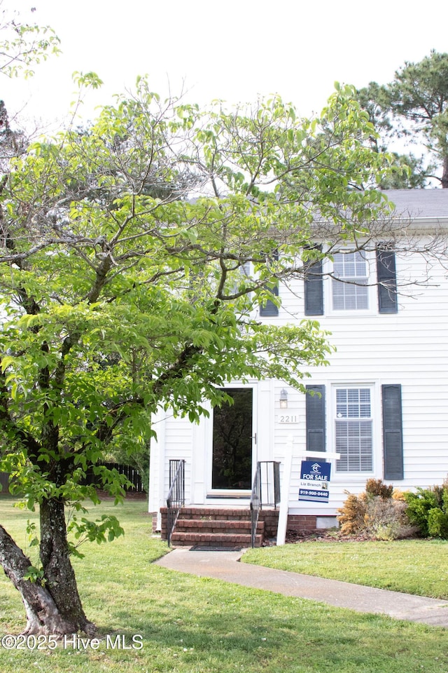 colonial house with a front lawn