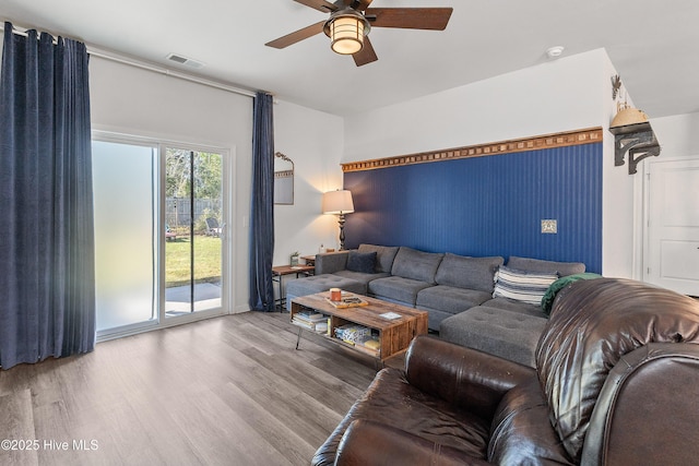 1524 Pleasant Hollow Ct SE, Bolivia, NC 28422 - living area with wood finished floors, a ceiling fan, and visible vents