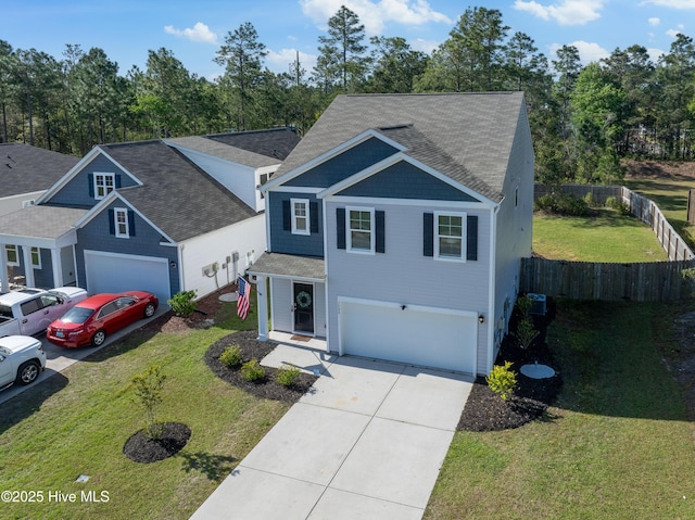 1524 Pleasant Hollow Ct SE, Bolivia, NC 28422 - view of front of property featuring roof with shingles, driveway, a front yard, a garage, and fence