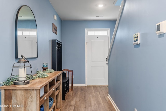 1524 Pleasant Hollow Ct SE, Bolivia, NC 28422 - interior space featuring visible vents, baseboards, light wood-type flooring, and arched walkways