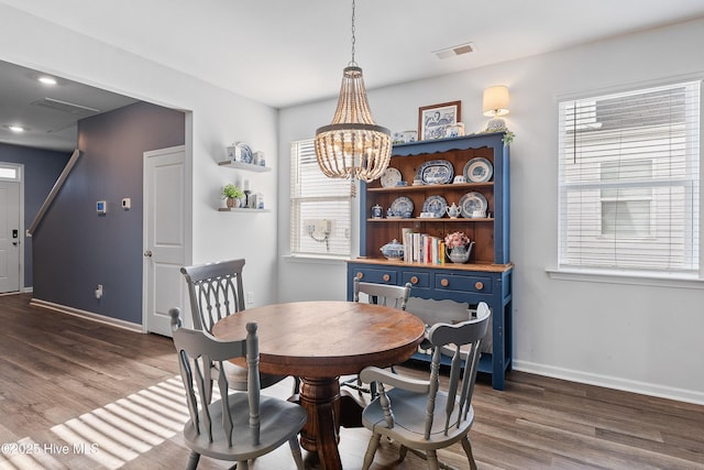 1524 Pleasant Hollow Ct SE, Bolivia, NC 28422 - dining space with a notable chandelier, visible vents, baseboards, and dark wood-style floors