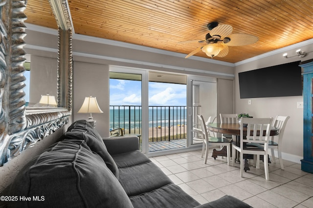 tiled living area featuring wooden ceiling, a ceiling fan, and ornamental molding