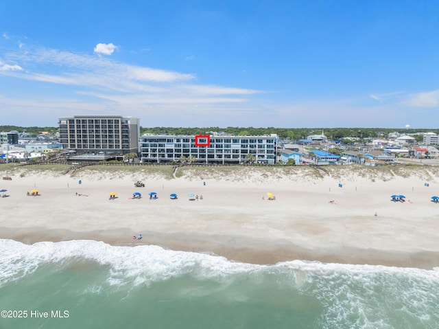 drone / aerial view of waterfront with a beach