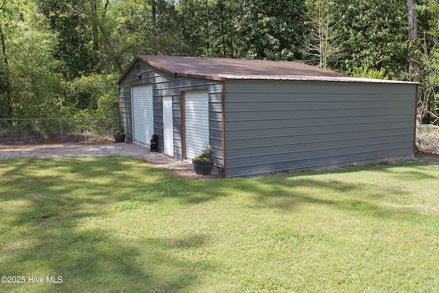 view of outbuilding featuring an outbuilding and fence