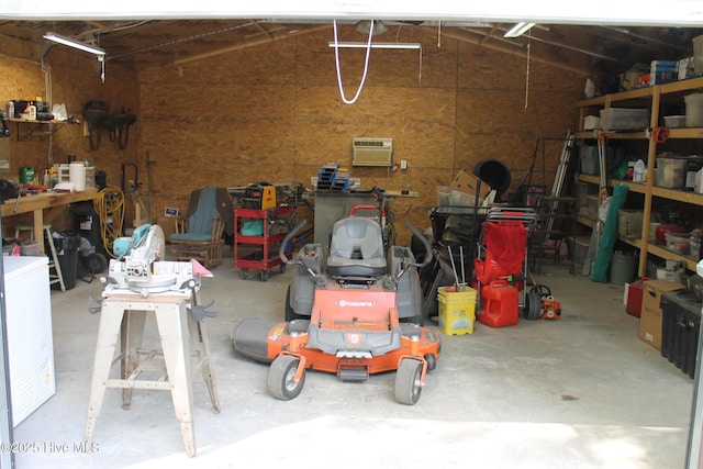 garage featuring an AC wall unit