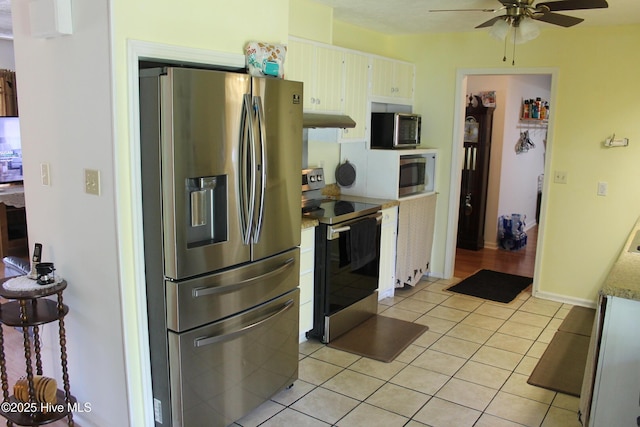 kitchen featuring light countertops, ceiling fan, under cabinet range hood, stainless steel appliances, and light tile patterned flooring