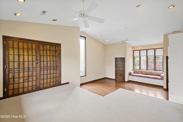 unfurnished room with wood finished floors, ceiling fan, recessed lighting, and vaulted ceiling