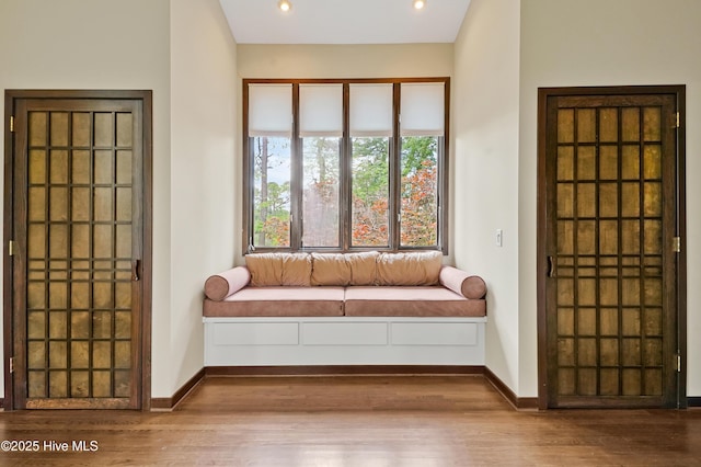 living area featuring recessed lighting, wood finished floors, and baseboards