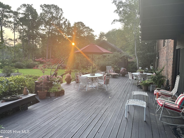deck with outdoor dining area