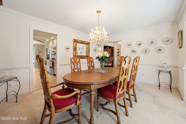 3378 Willow Cir SE, Southport, NC 28461 - dining area with light carpet, crown molding, a chandelier, baseboards, and a ceiling fan