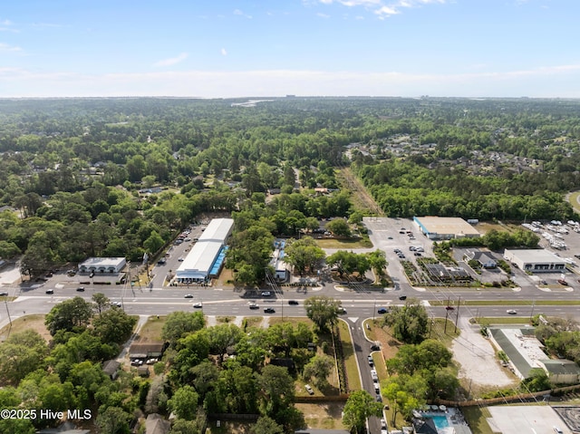 aerial view featuring a wooded view