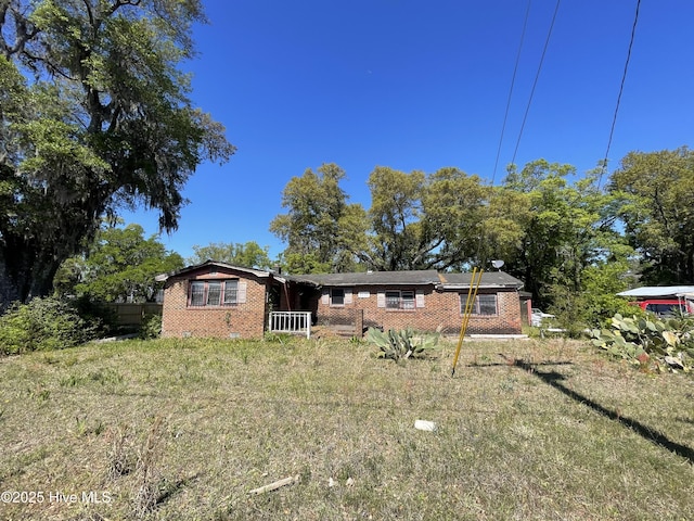 view of front of house featuring brick siding