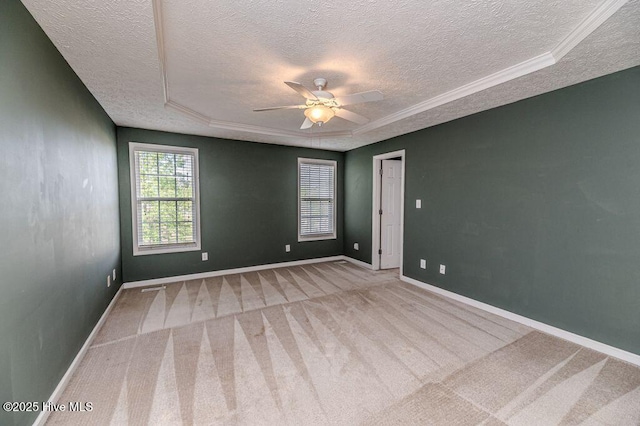 spare room with baseboards, carpet flooring, a textured ceiling, and a ceiling fan