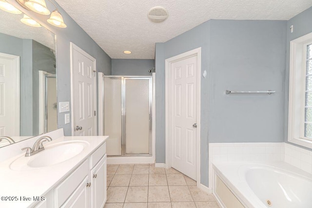 bathroom featuring tile patterned flooring, vanity, visible vents, and a stall shower