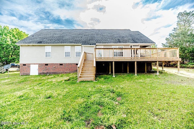 back of property with stairs, a deck, a yard, and a shingled roof