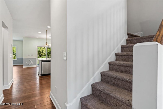 354 Trevally Ct, Southport, NC 28461 - stairway featuring wood finished floors, baseboards, and recessed lighting