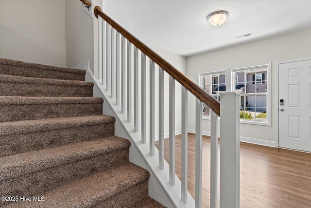 354 Trevally Ct, Southport, NC 28461 - staircase with wood finished floors