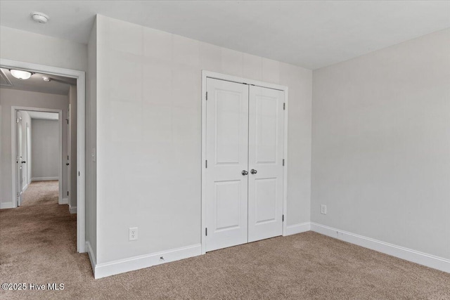 354 Trevally Ct, Southport, NC 28461 - unfurnished bedroom with carpet floors, a closet, and baseboards