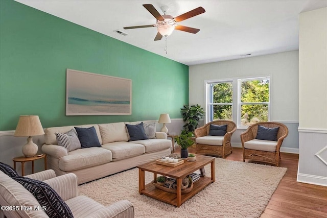 354 Trevally Ct, Southport, NC 28461 - living room with a ceiling fan, wood finished floors, and baseboards