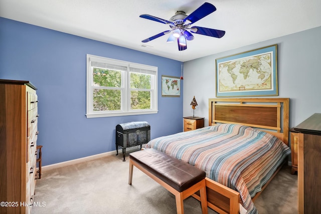 bedroom featuring carpet floors, baseboards, a ceiling fan, and visible vents