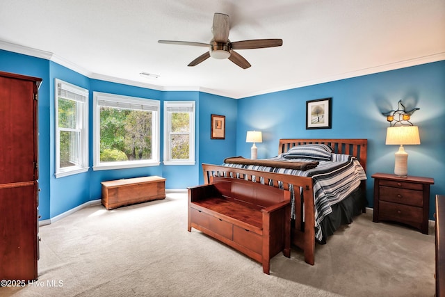 bedroom with carpet floors, ornamental molding, visible vents, baseboards, and a ceiling fan