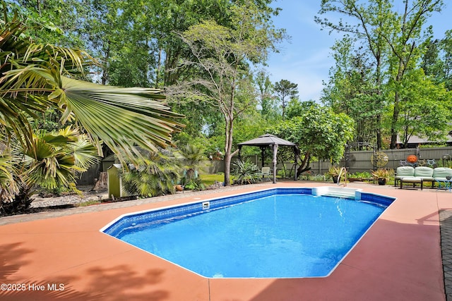 view of pool with a fenced in pool, a patio, a gazebo, and a fenced backyard