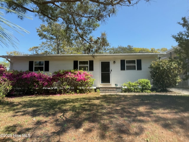 ranch-style house with a front lawn