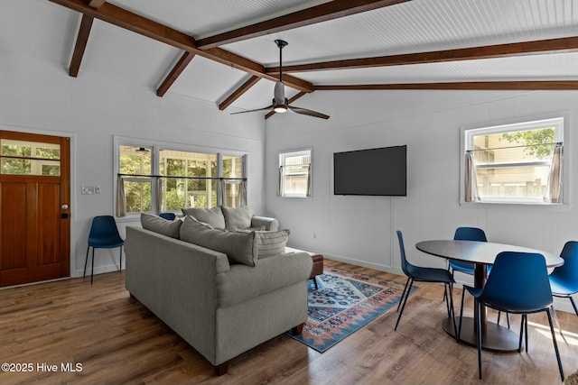 living room with vaulted ceiling with beams, a ceiling fan, and wood finished floors