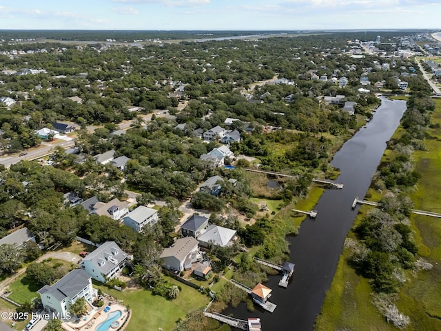 drone / aerial view with a residential view and a water view