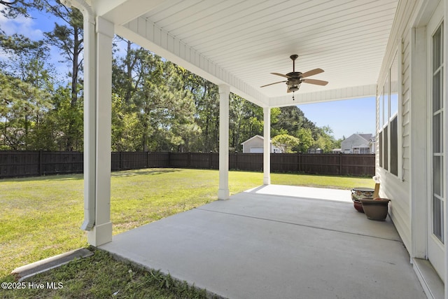 view of patio with a fenced backyard and a ceiling fan