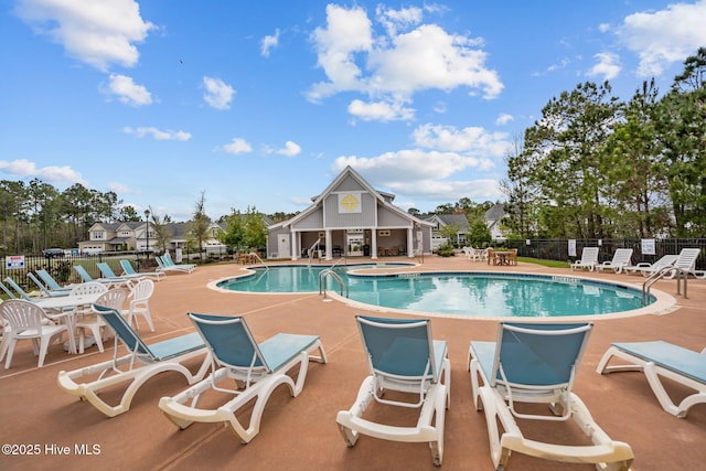 4541 Parsons Mill Dr, Castle Hayne, NC 28429 - community pool featuring a patio area, fence, and an outdoor structure