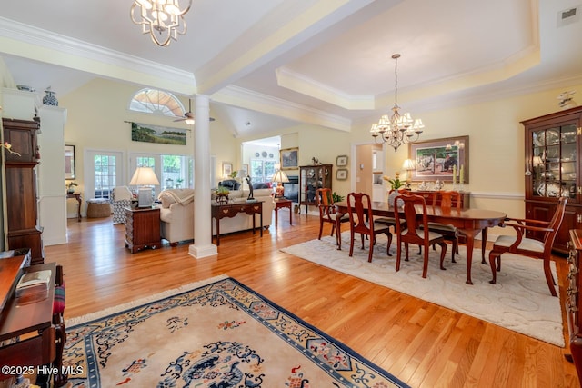 dining room with a chandelier, ornamental molding, and wood finished floors